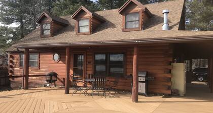 Family Friendly Lakefront Cedar Log Cabin on 2 acres at Rainbow Lake.