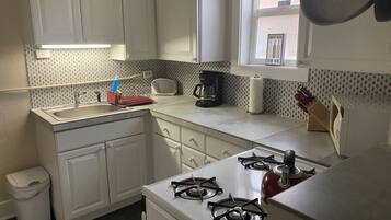 Fridge, oven, cookware/dishes/utensils