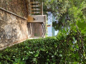 Secure entrance to a residence surrounded by lush greenery.