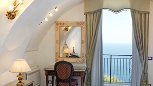 A room with a desk, chair, and a large mirror with a decorative frame. There is a lamp on the desk, and a window with curtains. - Borgo antico 1, Romantic Amalfi Villa Amalfi With Stunning Sea View, gardens (Amalfi)