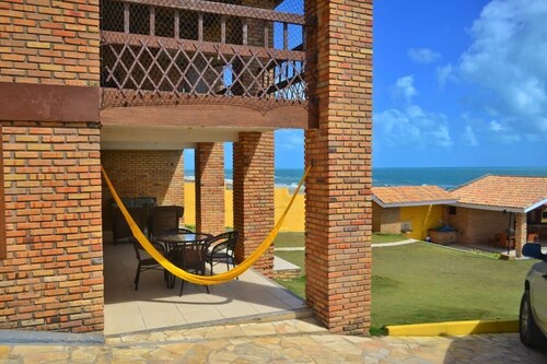 Luxurious beach house with pool, seafront terrace.