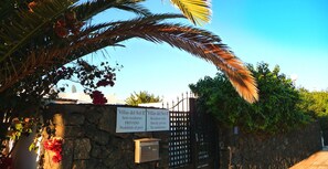A gated entrance with signs indicating 'Villas del Sol II' and 'PRIVADO' (private). - The Villa is Superbly Located on a Small Complex (Puerto del Carmen)