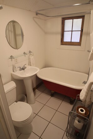 Combined shower/tub, hair dryer, towels, toilet paper