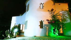 A white building with a round tower, a small window, and a door. - Peaceful family villa with private pool & magnificent views, nr. perfect beaches (Calonge)
