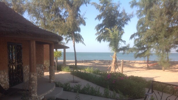 A beachfront property with a stone building, a sandy beach, and a clear view of the sea. - Between sea and lagoon, Keur Océan, a "PARADISE" (Pointe sarene)