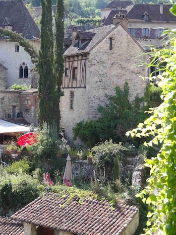Main View of the House with the Cyprus tree in the garden.