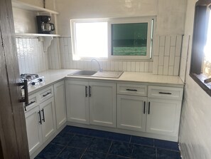 Fridge, stovetop, coffee/tea maker, cookware/dishes/utensils - Absolute Ocean Front Studio Loft.  In the heart of Surf City (La Libertad)