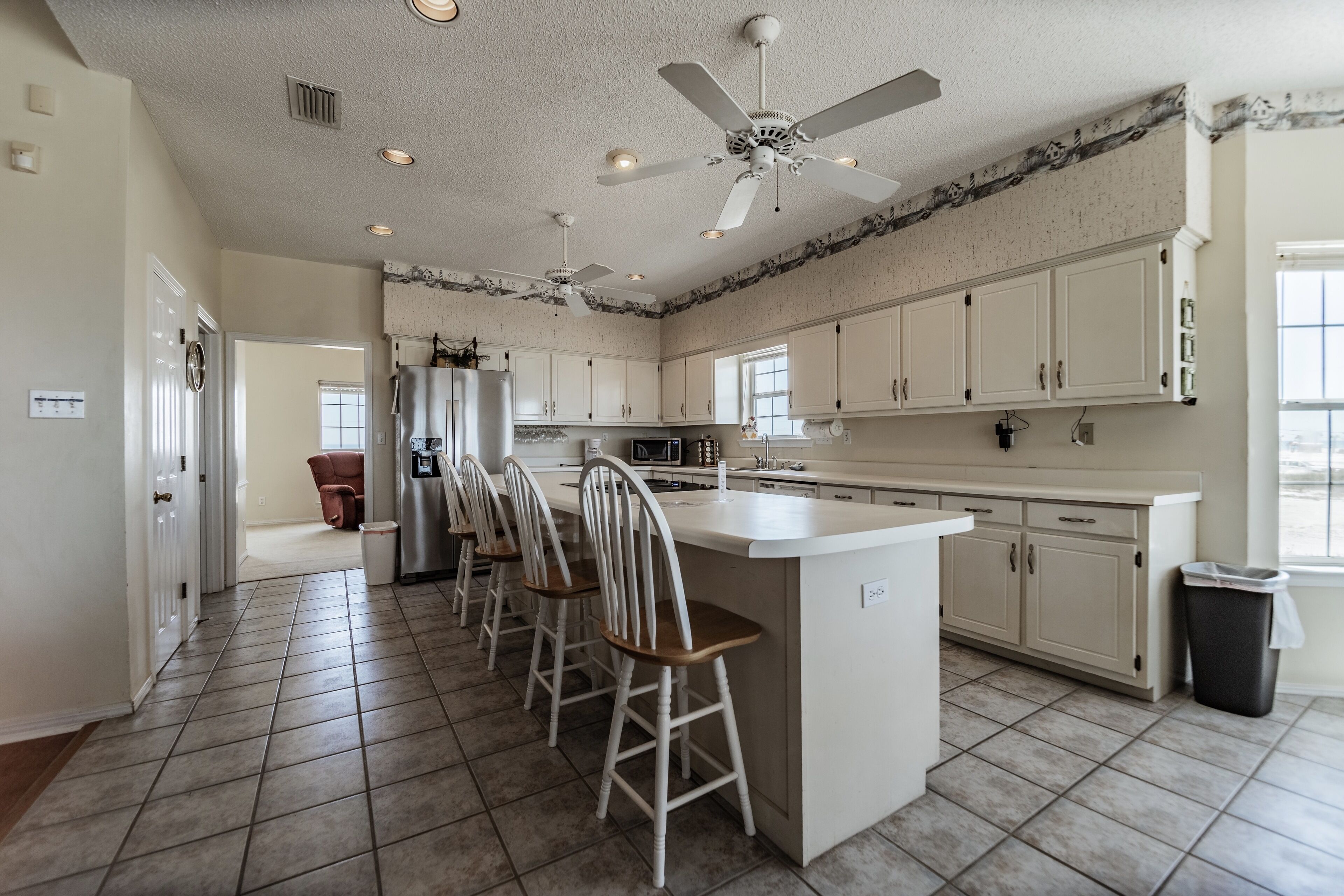 Large Bayfront Home on sandy Bay beach with large screened porch.