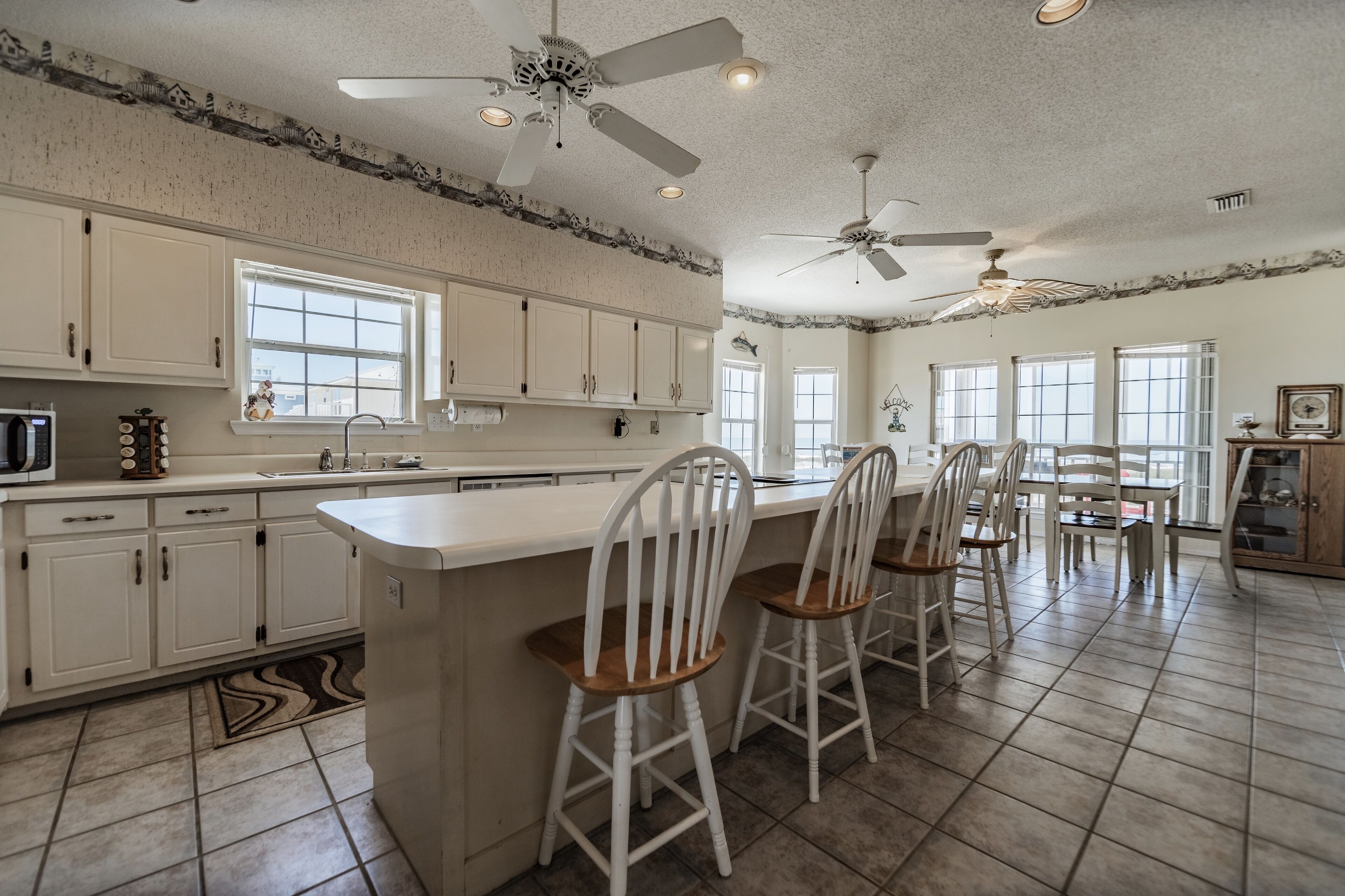 Large Bayfront Home on sandy Bay beach with large screened porch.