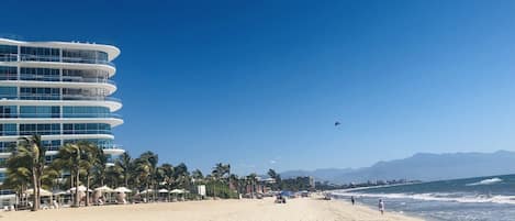 On the beach, sun-loungers, beach towels