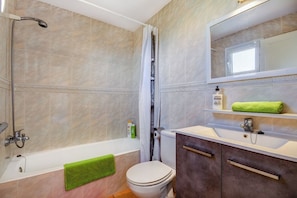 Bathtub, hair dryer, towels