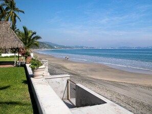 On the beach, sun-loungers
