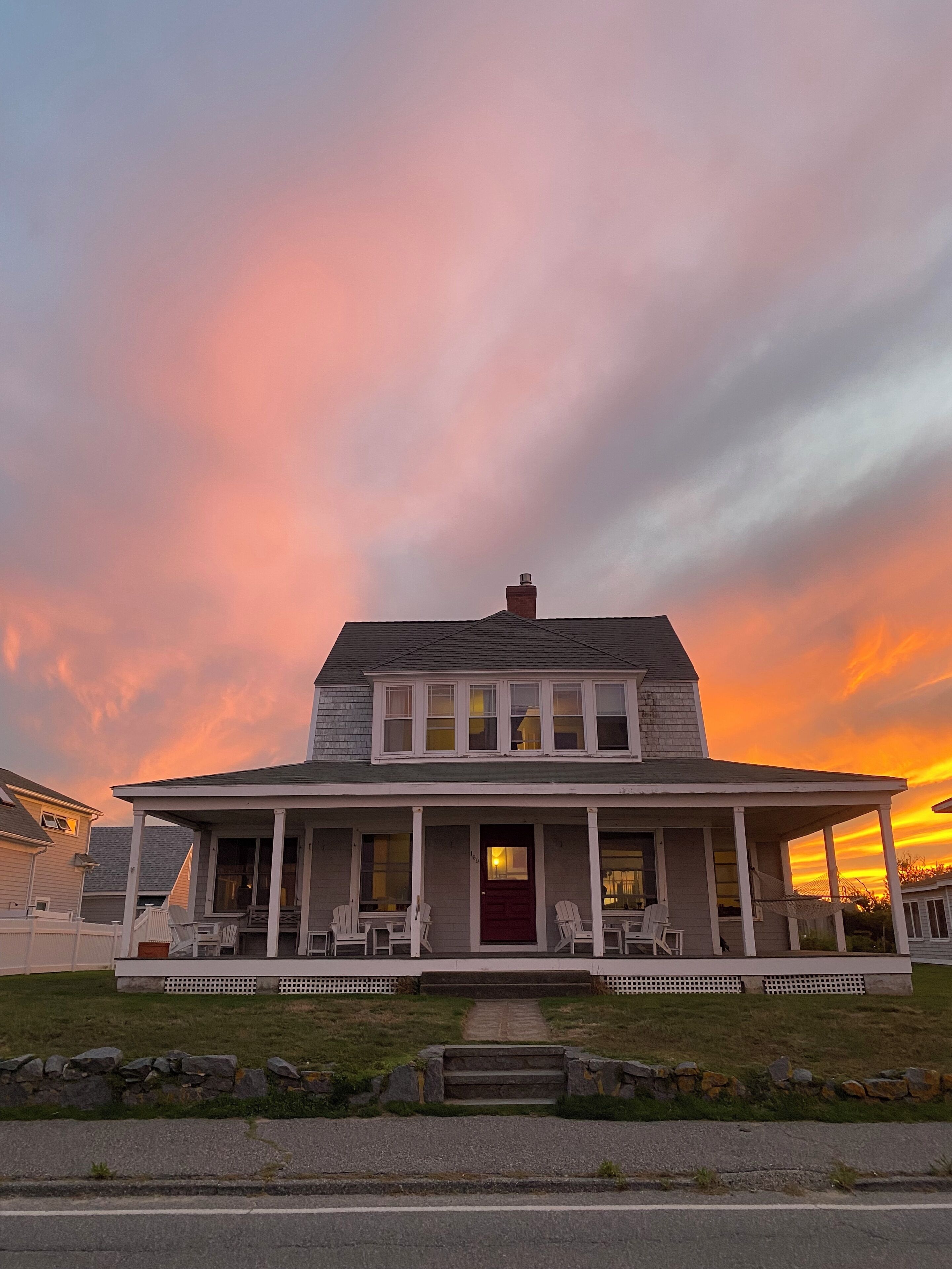 Exterior view from across the street at sunset.