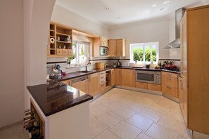 kitchen area to open plan dining area and outside terraces