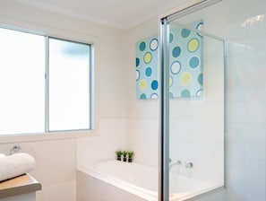 Bathtub, hair dryer, towels, soap