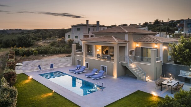 A modern villa with a swimming pool, outdoor seating, and a staircase leading to a balcony. - Sailing Villa Kefalonia (Karavados / Leivathos)