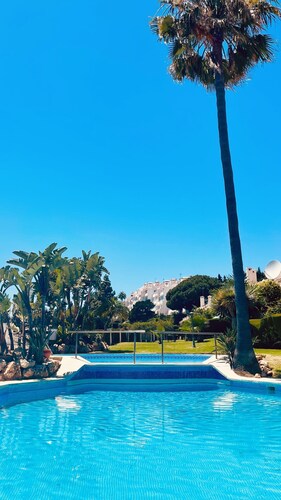 Modern garden apartment with a fantastic view of the sea and a private garden