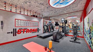 A gym with treadmills, weight machines, and a red mat.