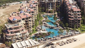 A resort with multiple buildings, a large swimming pool, and a beach. - Dream Penthouse - Infinity Jacuzzi + Best View in Cabo (Cabo San Lucas)