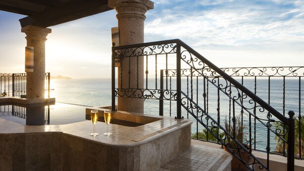 A stone staircase leading to a balcony with a view of the sea. - Dream Penthouse - Infinity Jacuzzi + Best View in Cabo (Cabo San Lucas)