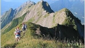 A group of hikers on a mountain trail with rugged terrain and distant mountain peaks. - Cosy Chalet in the Real Alps near Annecy.
Relax, chill, walk, cycle, trek, ski. (Le Châtelard)