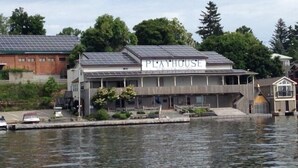 A Playhouse building with a sign, located near a body of water. - Cottage For Rent-1000 Islands (Gananoque)