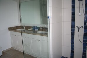 Shower, hair dryer, towels, toilet paper