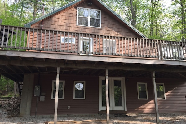 House settled back in Private Drive and Partial Lake Views, Beach near driveway