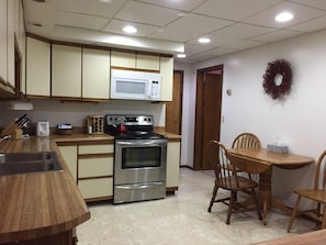 Large kitchen with expandable kitchen table.