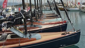 A marina with multiple sailboats docked, featuring wooden decks and tall masts. - Elegance and nice view over Cap D'Antibes and beaches (Antibes)