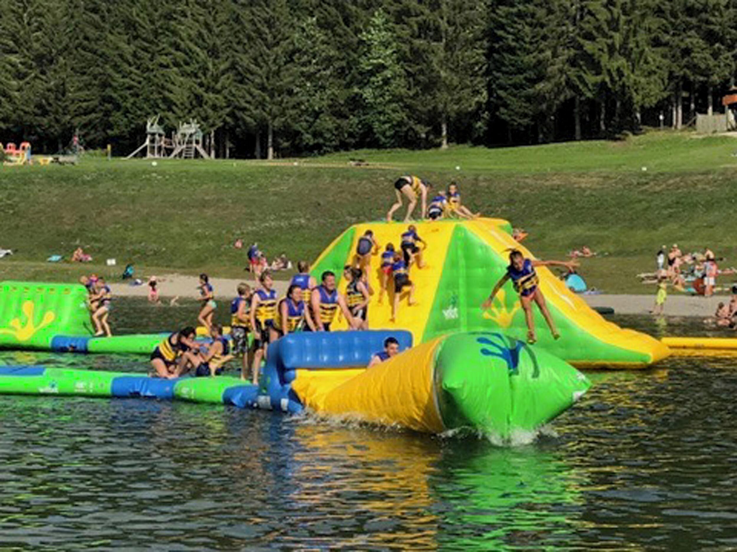 A water park with inflatable slides and pools.