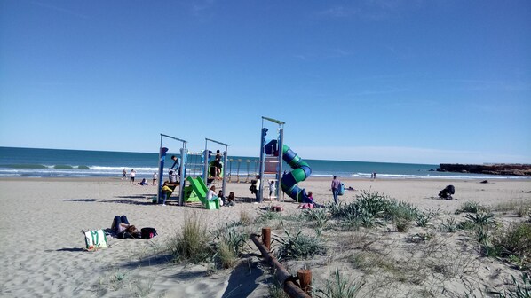 On the beach, sun-loungers