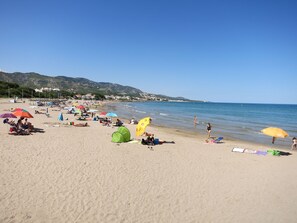On the beach, sun loungers