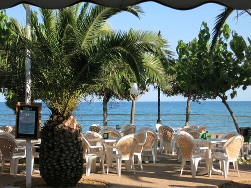 Luxury air conditioned beach front apartment with large patio.