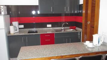 Fridge, microwave, stovetop, coffee/tea maker