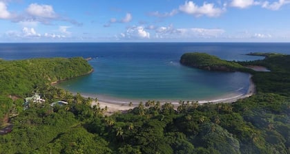 Half Moon Villa :- A beautiful villa with a large pool & garden, ocean views.