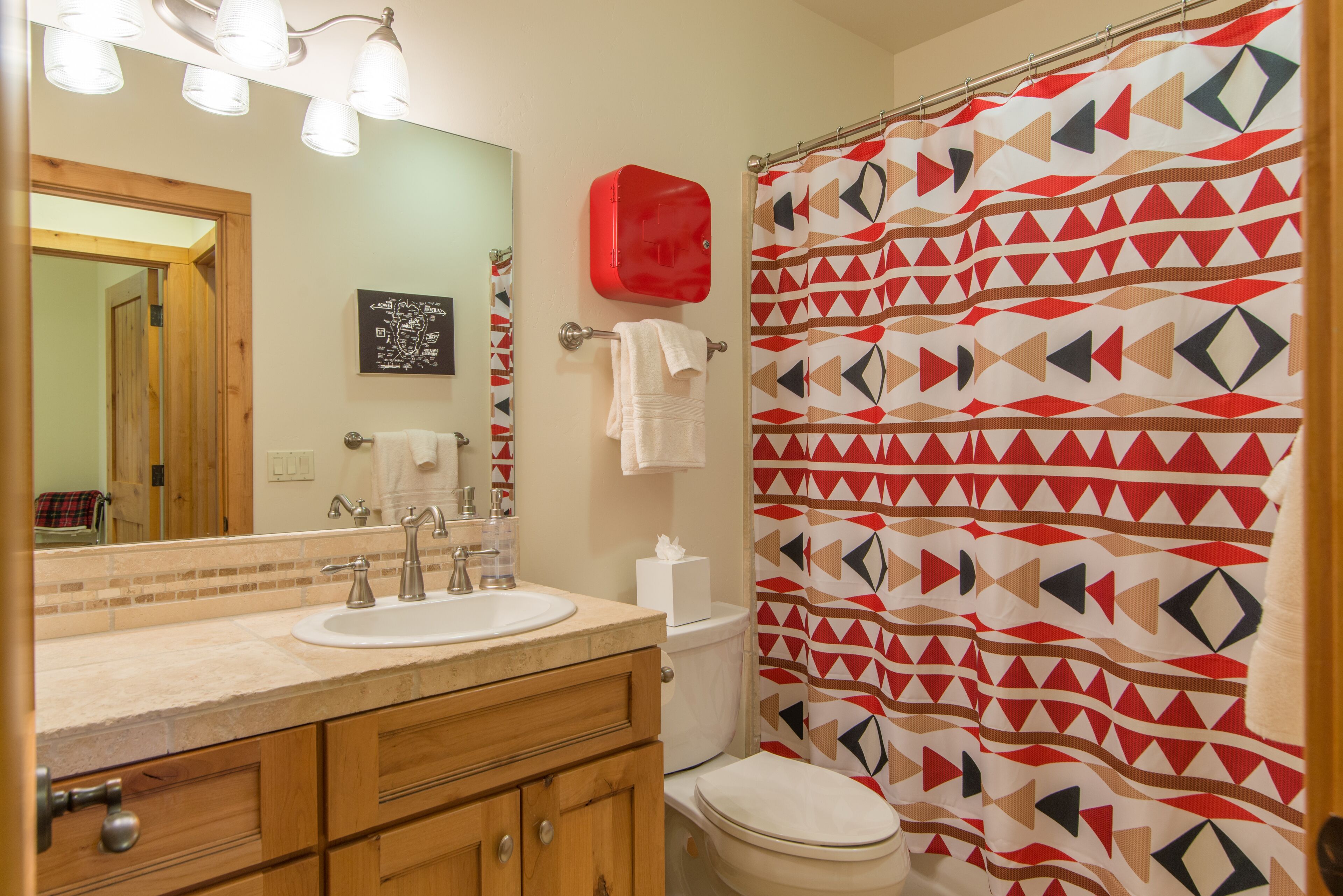 Downstairs bathroom has a shower/tub combo.
