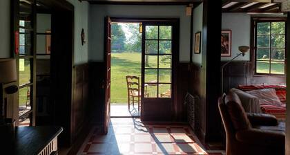 Large family home with wooded grounds, orangery, courtyard, outbuilding in quiet location.