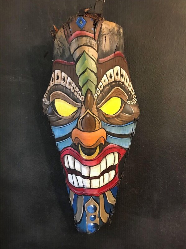 A colorful mask with intricate patterns and designs.
