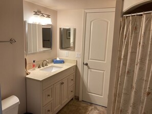 Combined shower/tub, hair dryer, towels, soap