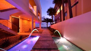 A modern building with a pool and a covered walkway. - Pure luxury at #Sunset Wave on the Beach (Treasure Island)