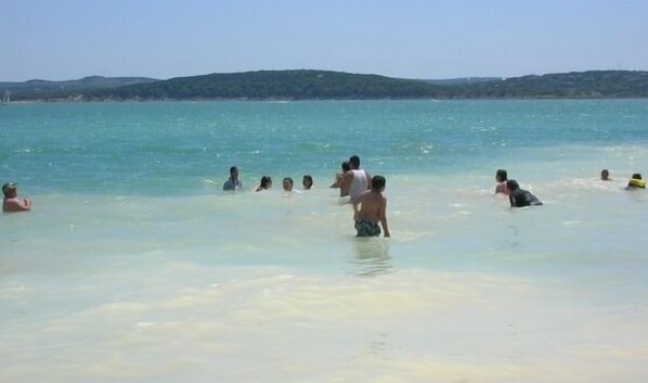 Guests can enjoy swimming and relaxation in the turquoise waters.