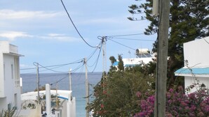 A narrow coastal pathway flanked by white buildings, leading to the sea. - Holiday rentals: Charming house between sea and mountain, (RAFRAF)