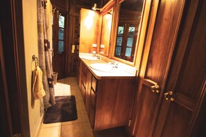 Combined shower/bathtub, towels, soap, toilet paper