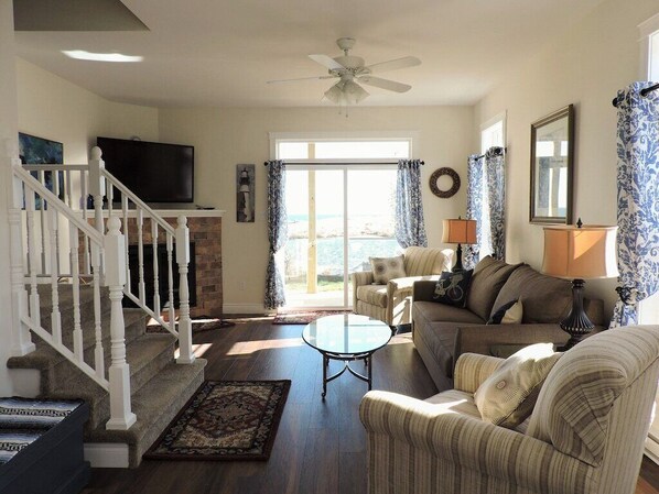 TV, fireplace, books - Oceanfront ADA Compliant Condo - TidePool (Southwest Harbor)