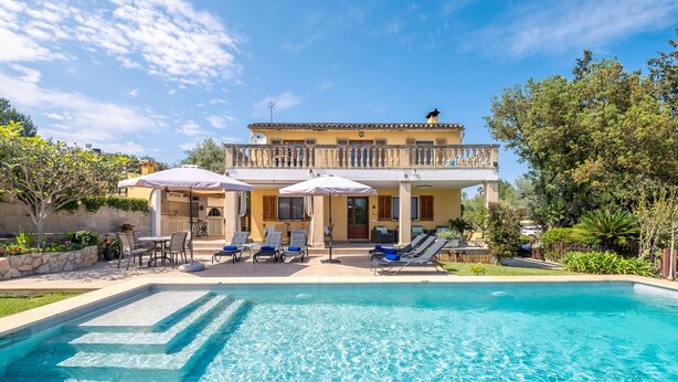 A two-story building with a swimming pool, outdoor seating, and a balcony. - FINCA MARINA  VT/121 ref. VP11 (Pollensa / Pollença)