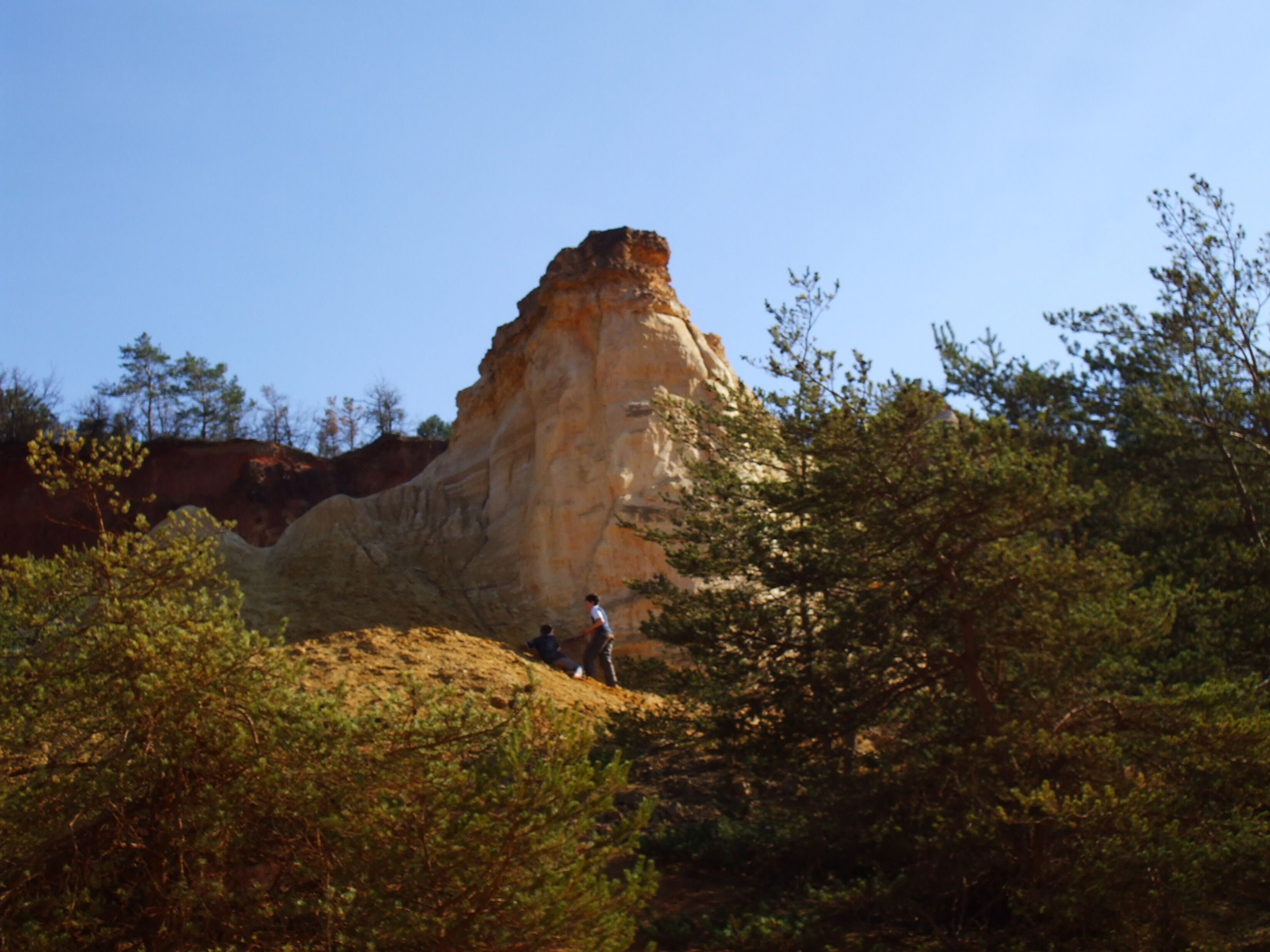 A natural rock formation with a clear sky.