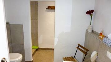 Shower, hair dryer, towels, toilet paper