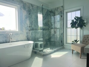 Combined shower/tub, hair dryer, towels, soap