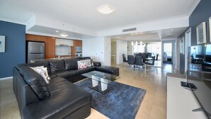 Deluxe Apartment, 3 Bedrooms, Accessible, Ocean View | Living area | 55-inch TV with premium channels, Netflix, DVD player - Deluxe Chevron Renaissance (Surfers Paradise)